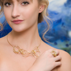 Model shot of 18kt gold endless love necklace