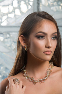 Model wearing silver and gold necklace | Nikki Sedacca Art Jewelry